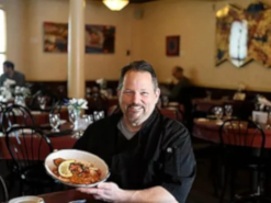 Chef holding a dish